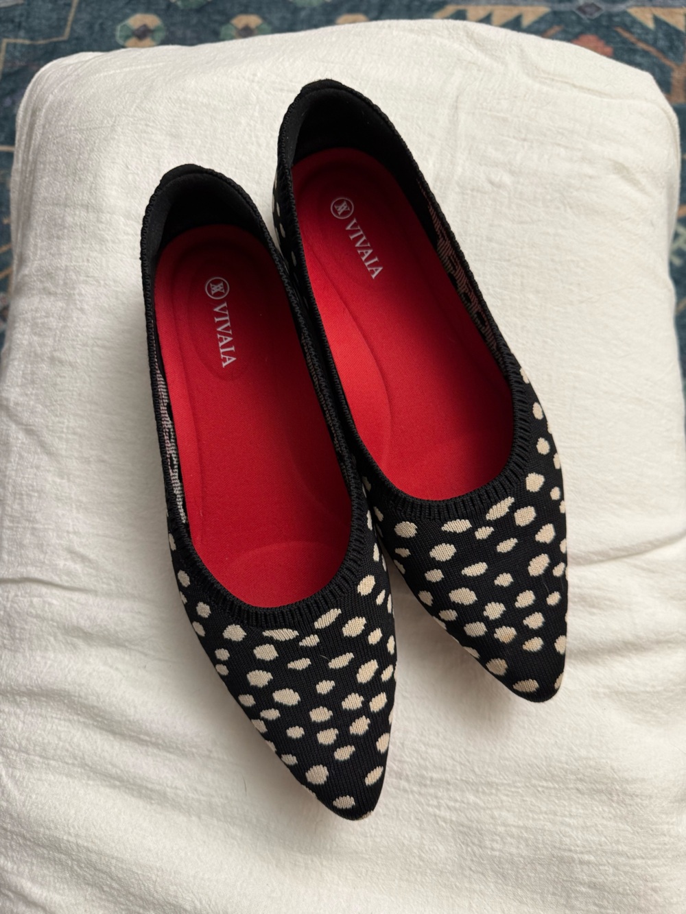 Black and white pointed toe flats